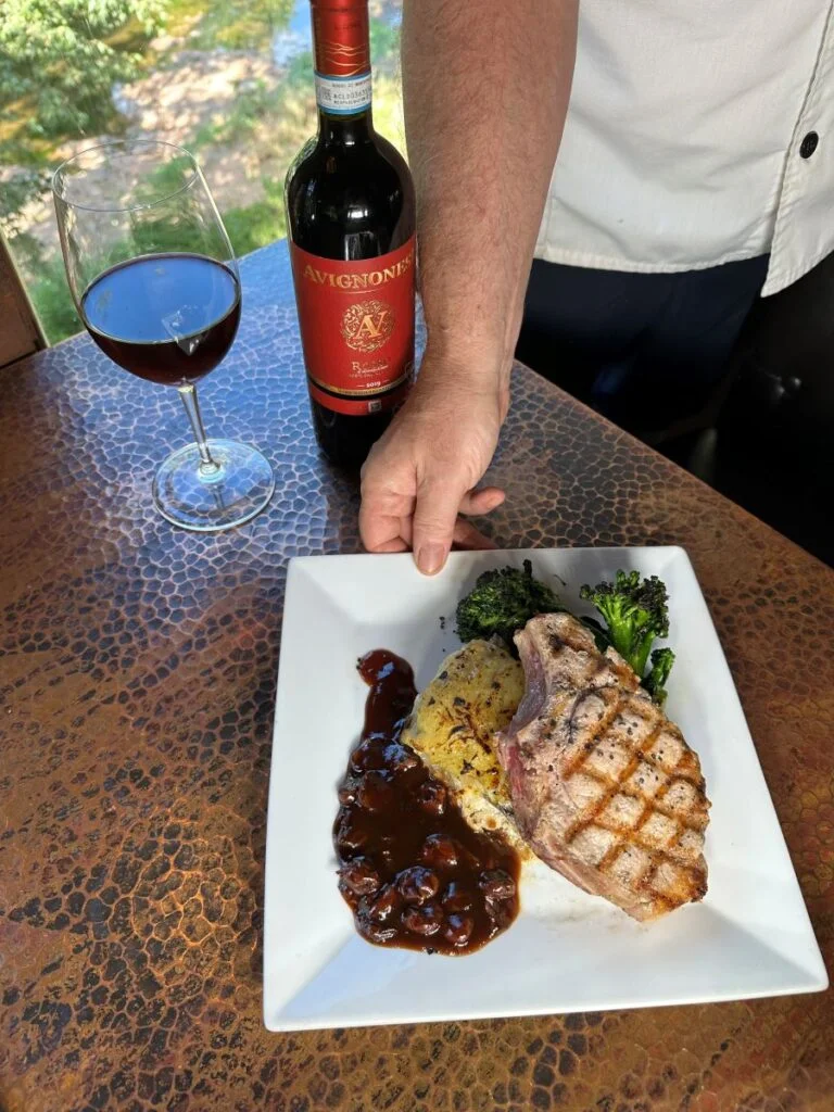 Jim presenting a porkdish with red wine